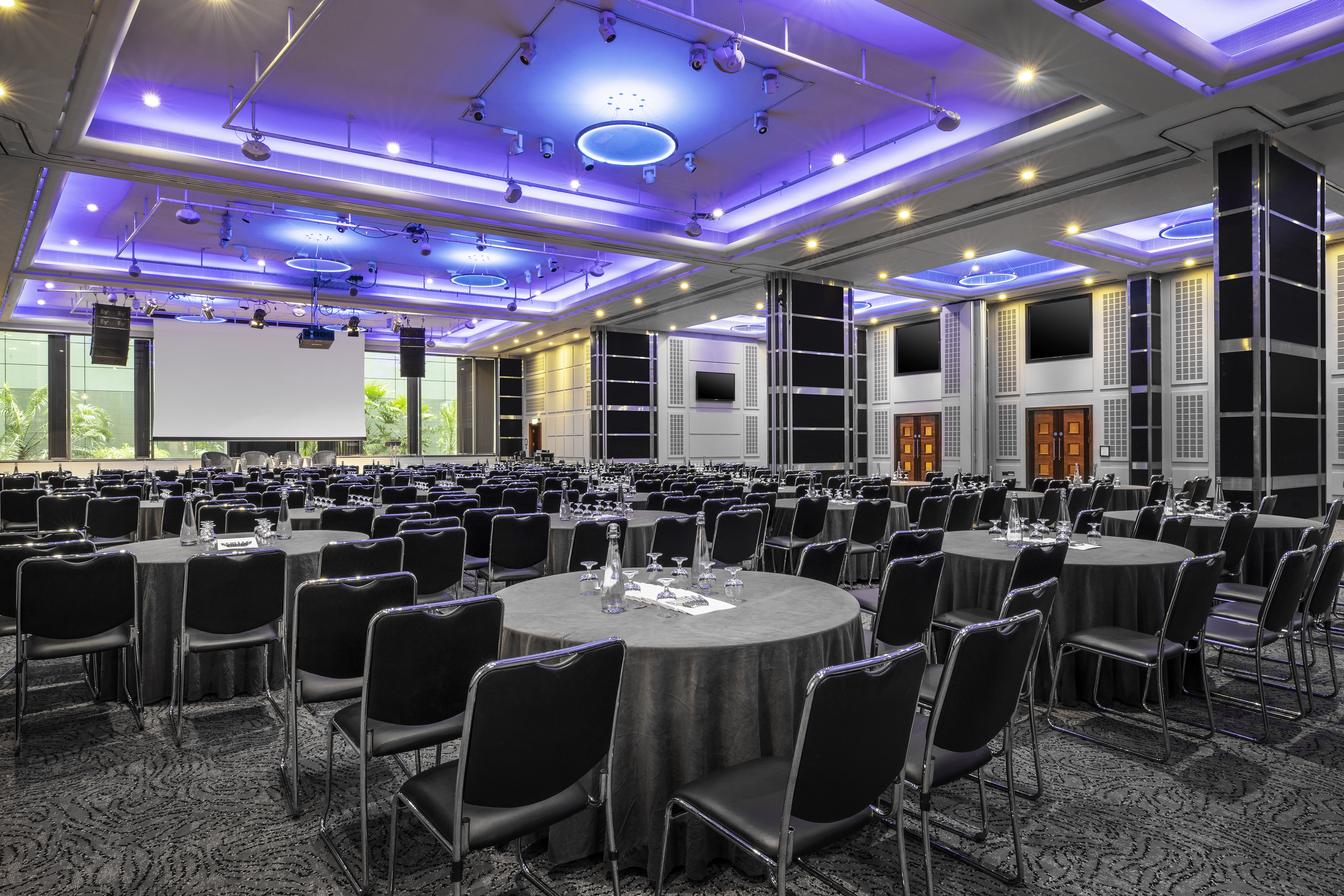 Wren & Shakespeare Suite at Leonardo Royal Hotel, elegant conference venue with blue lighting.