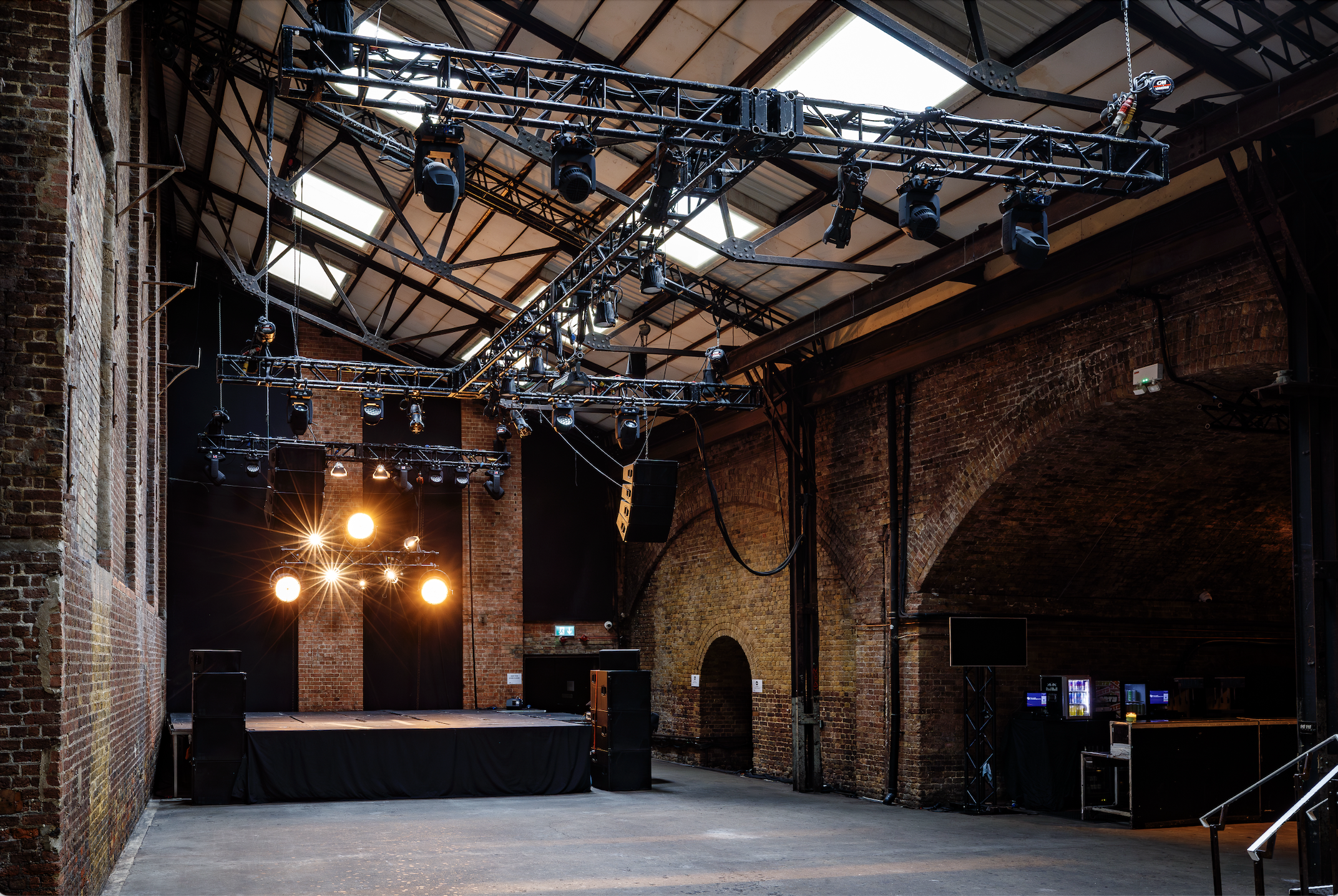 Versatile industrial event space at Village Underground with exposed brick walls.