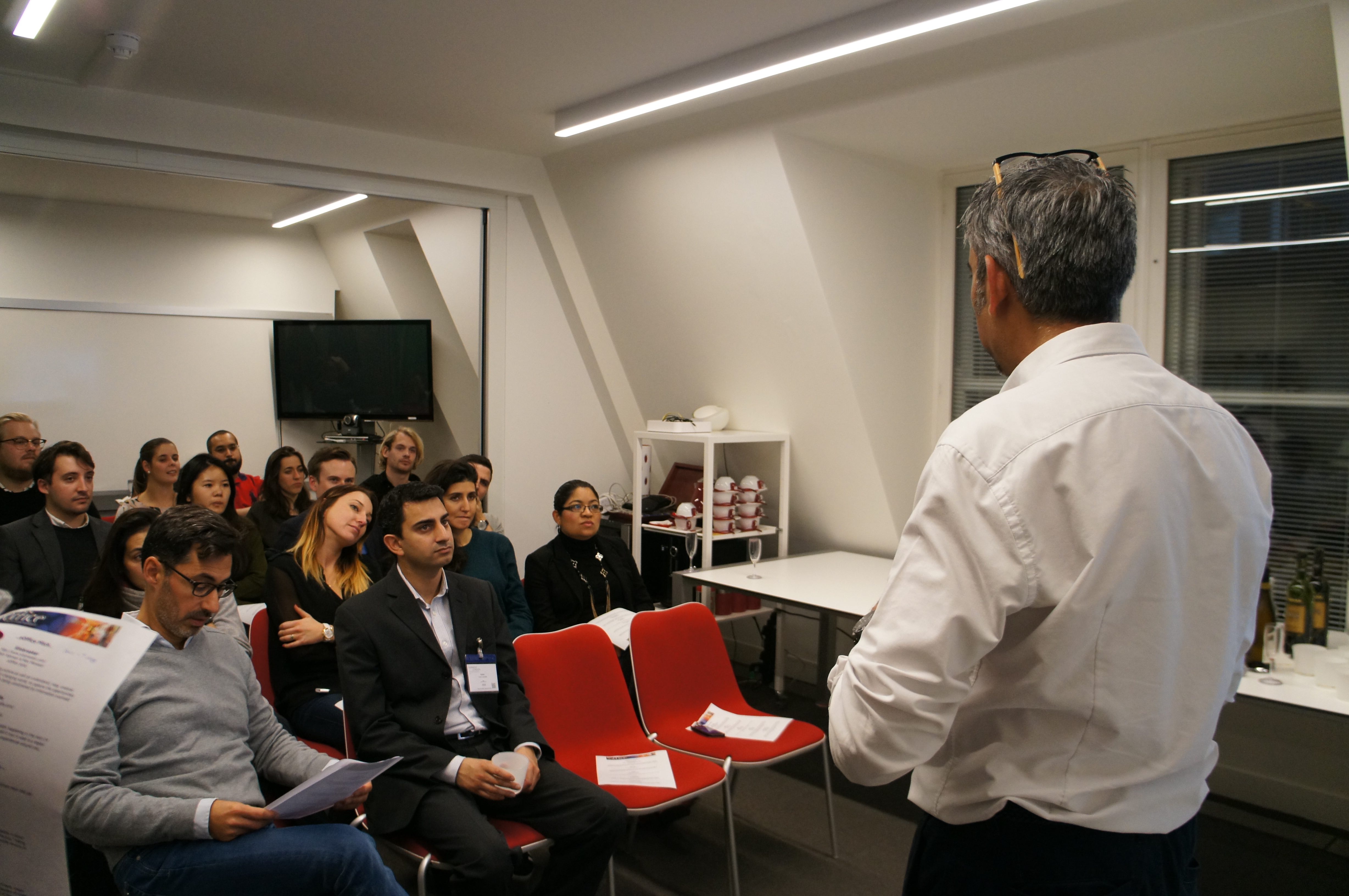 Conference Room in eOffice - Soho with engaged audience at a professional meeting. - Banner