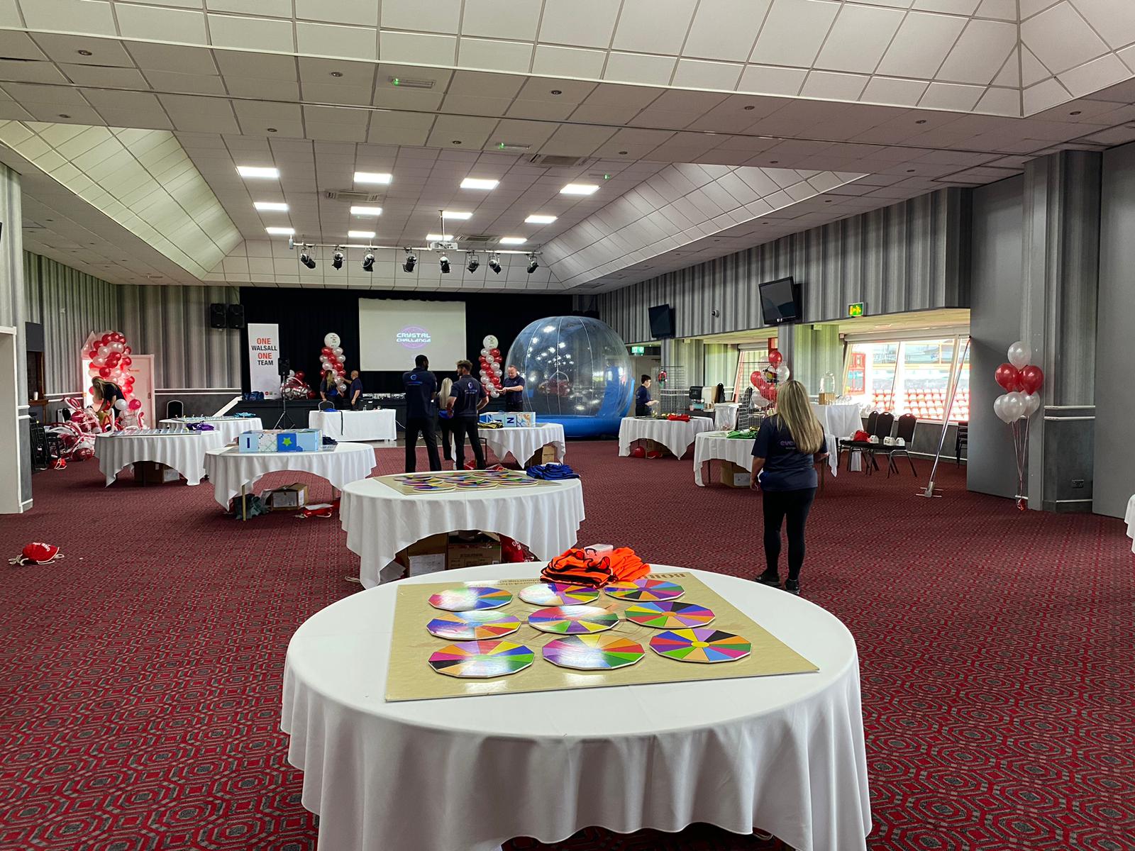 Spacious Walsall FC event venue with round tables for meetings and networking sessions.