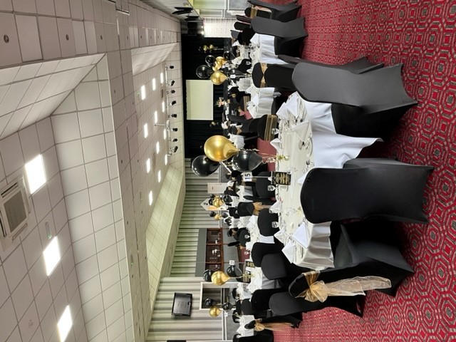 Elegant event space at Walsall FC with round tables, ideal for celebrations and gatherings.