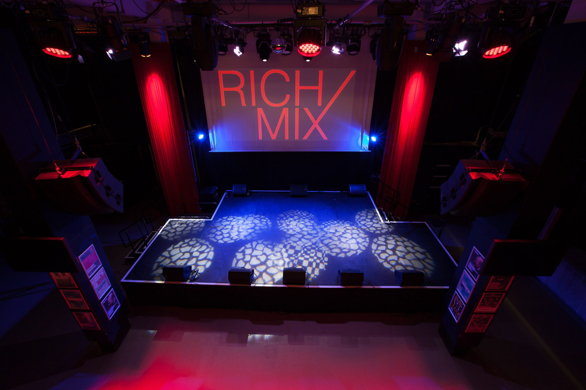 Well-lit stage at Rich Mix venue, ideal for performances and events with dynamic lighting.
