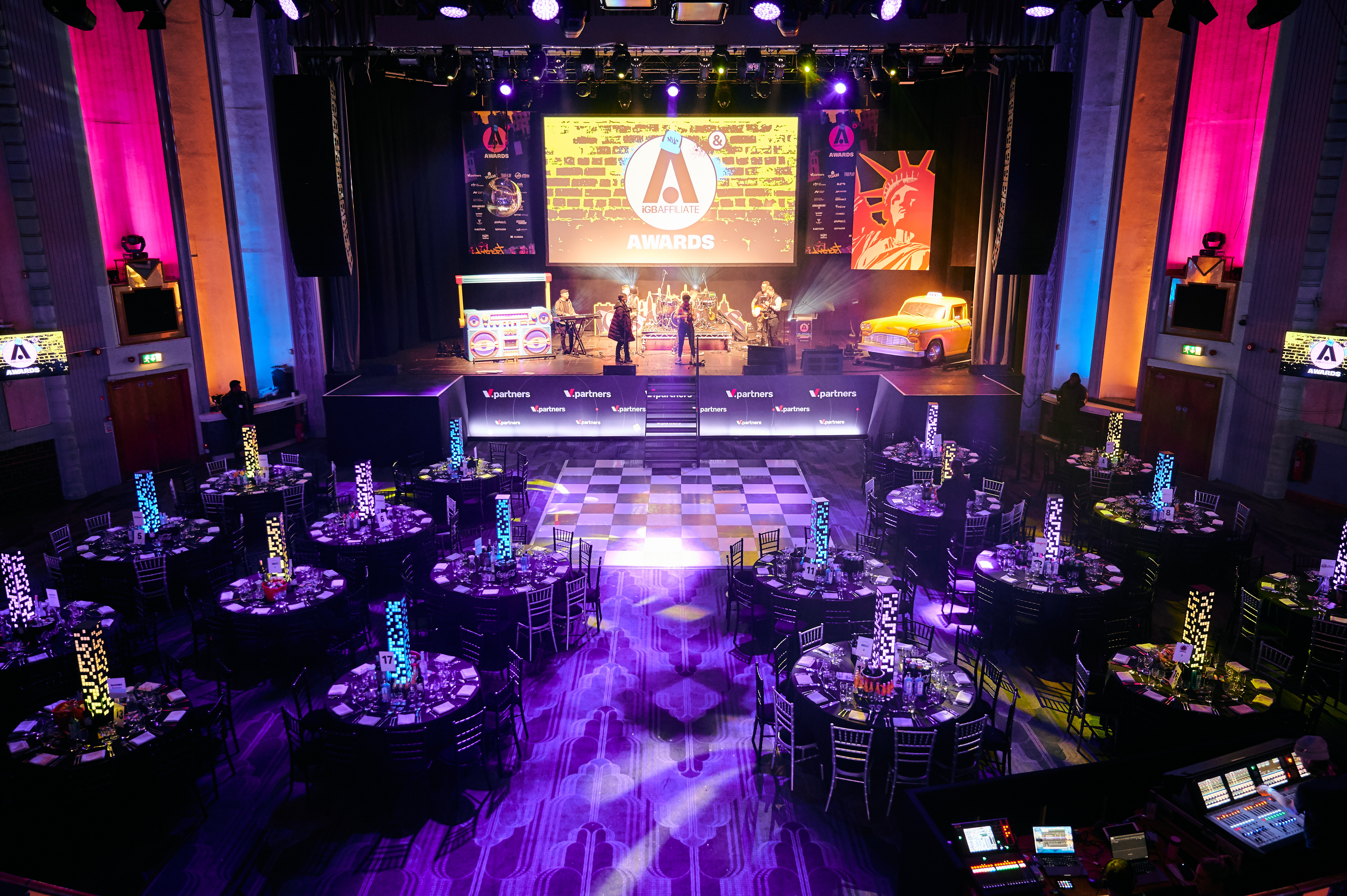 Elegant gala setup in Troxy's Grand Hall with vibrant decor and dynamic lighting.