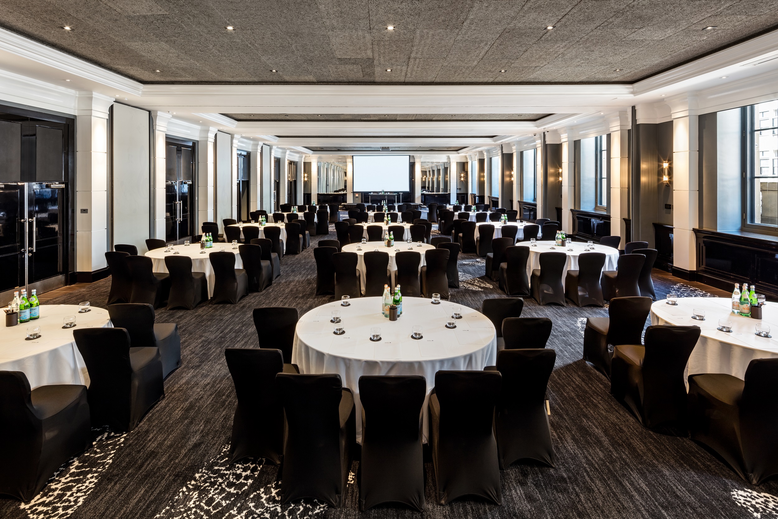 Halle Suite at The Edwardian Manchester, elegant conference space with round tables.