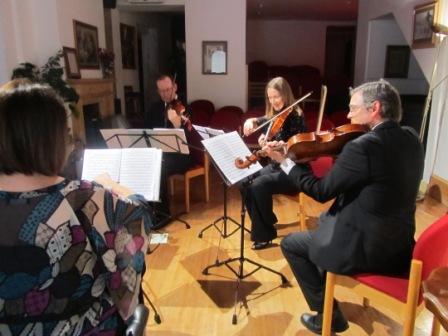 String quartet performing at The Salon Theatre, enhancing corporate events and private gatherings.
