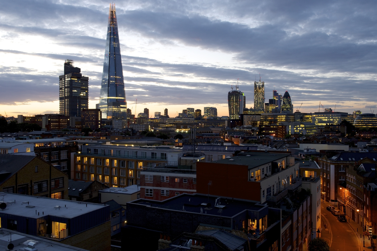 Lucy Loft Suite skyline view at dusk, ideal for corporate gatherings and events. - Banner