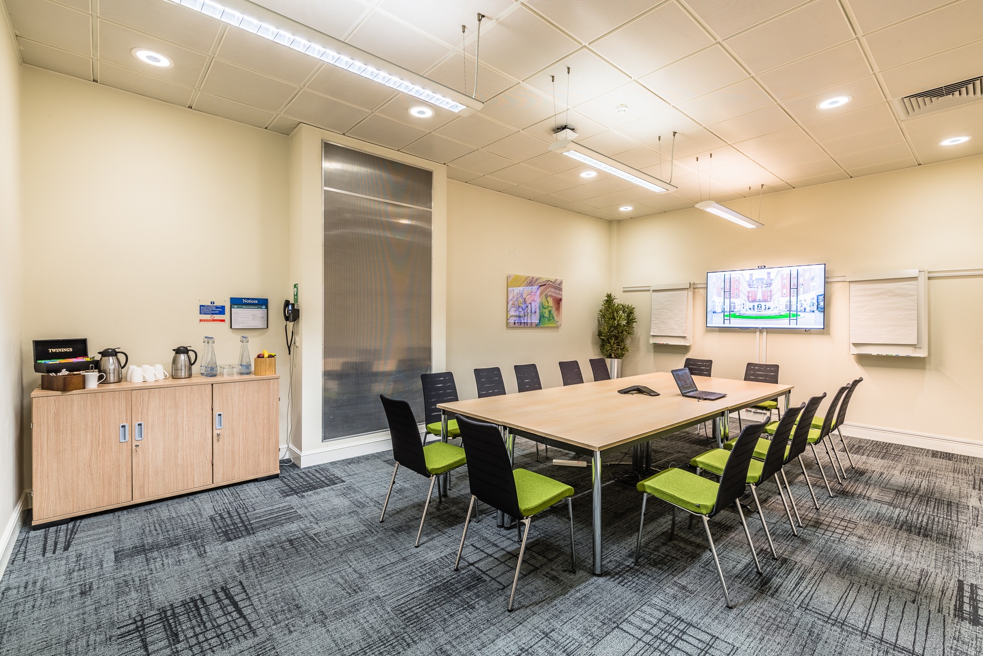 Jenner Room in BMA House: modern meeting space with dual screens for productive events.