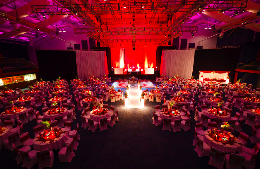 Elegant event space at Cheltenham Racecourse with vibrant decor for presentations.