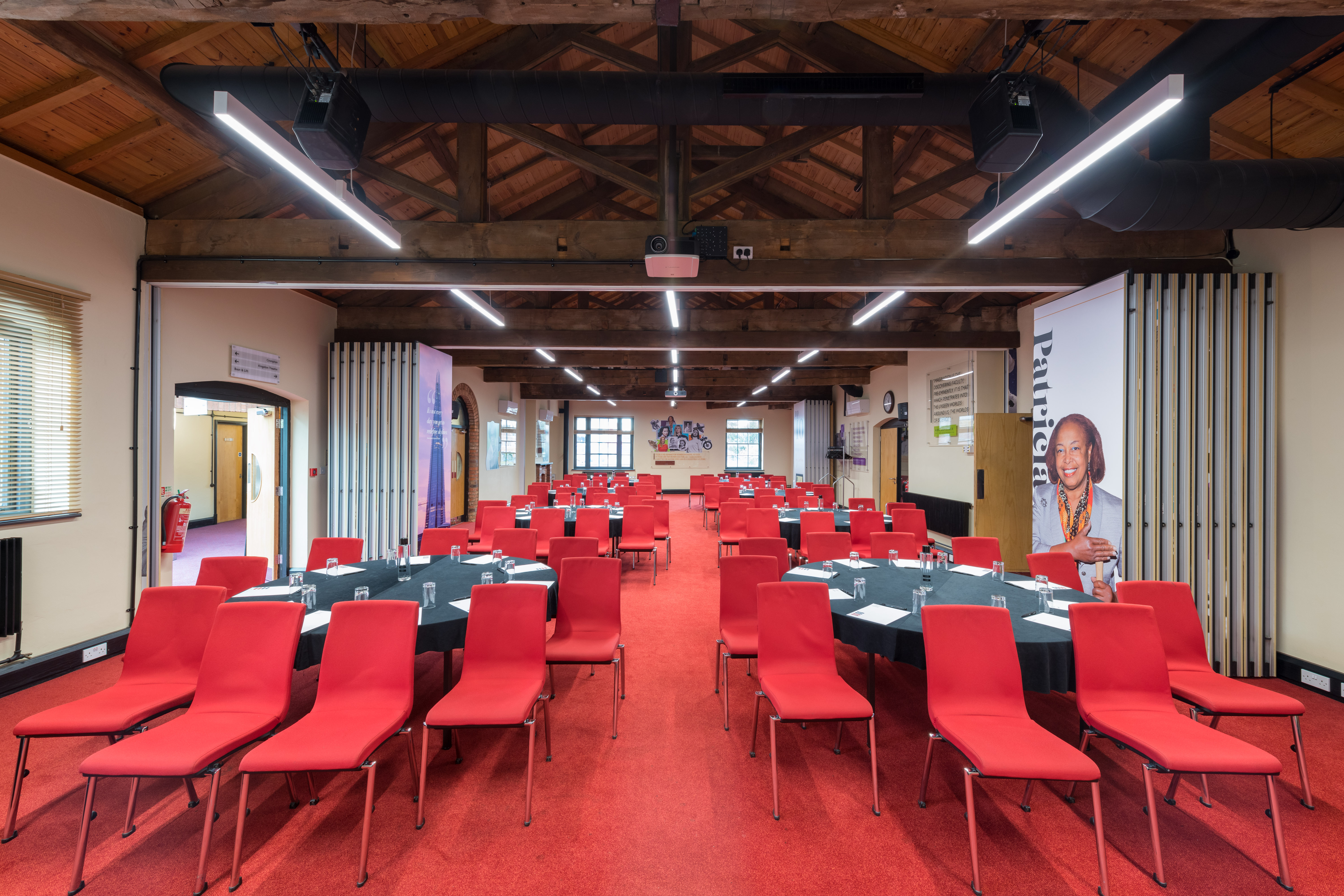 Lodge Rooms at IET Birmingham: Austin Court, featuring red chairs for corporate meetings.