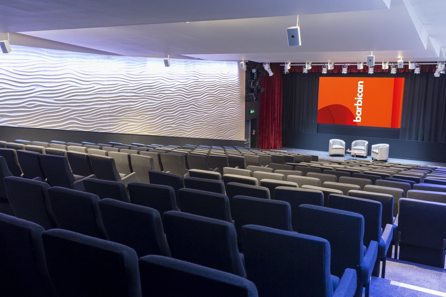 Frobisher Auditorium 1: modern event space with tiered seating for corporate meetings.