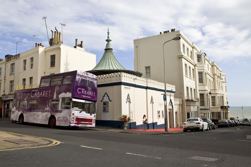 Vibrant Proud Cabaret Brighton venue with double-decker bus, ideal for events and meetings. - Banner