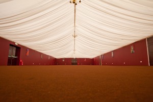 Elegant event tent with draped ceiling at The Dray Marquee, perfect for gatherings.
