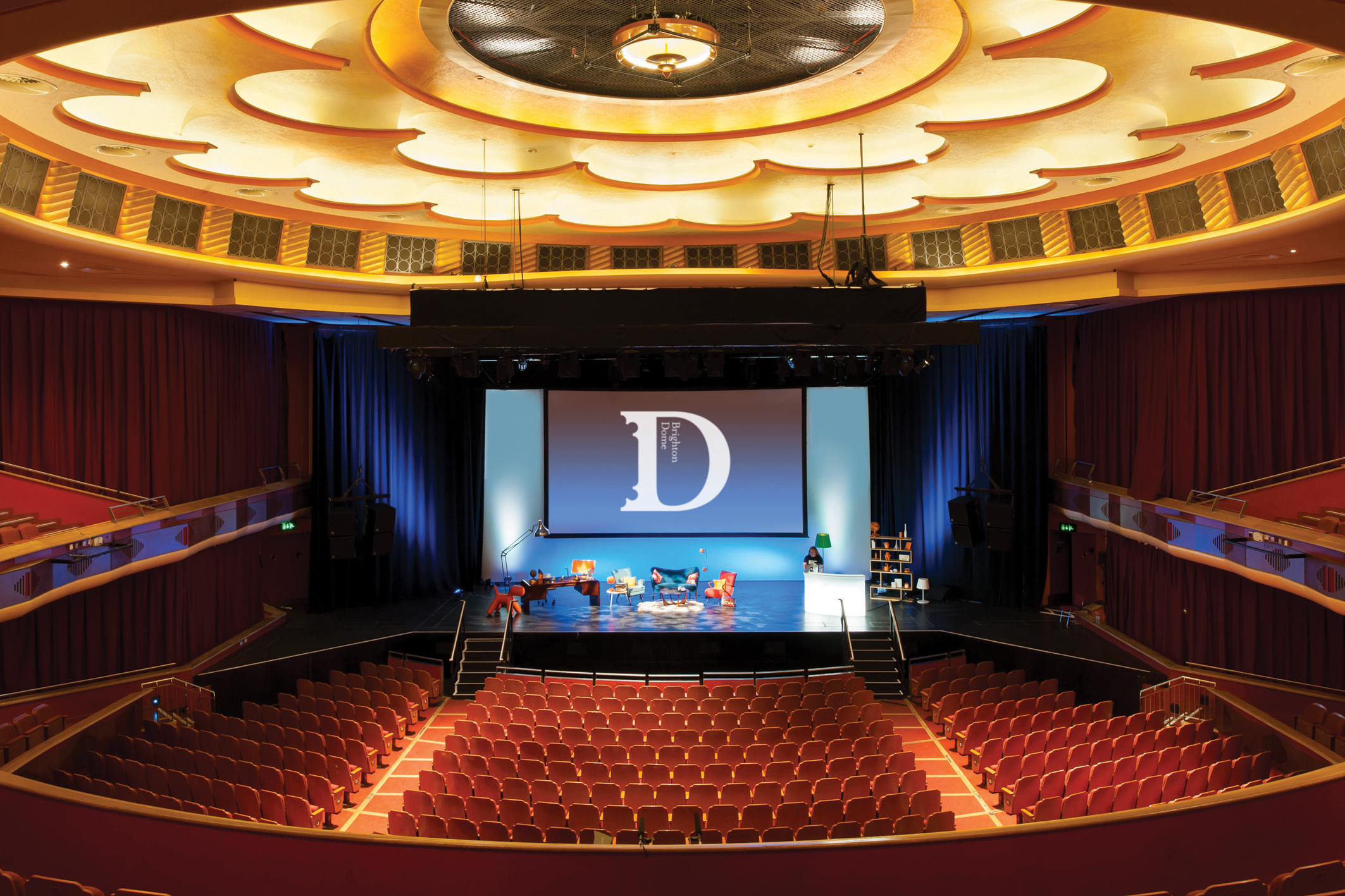 Brighton Dome Concert Hall auditorium with large stage, ideal for events and performances.