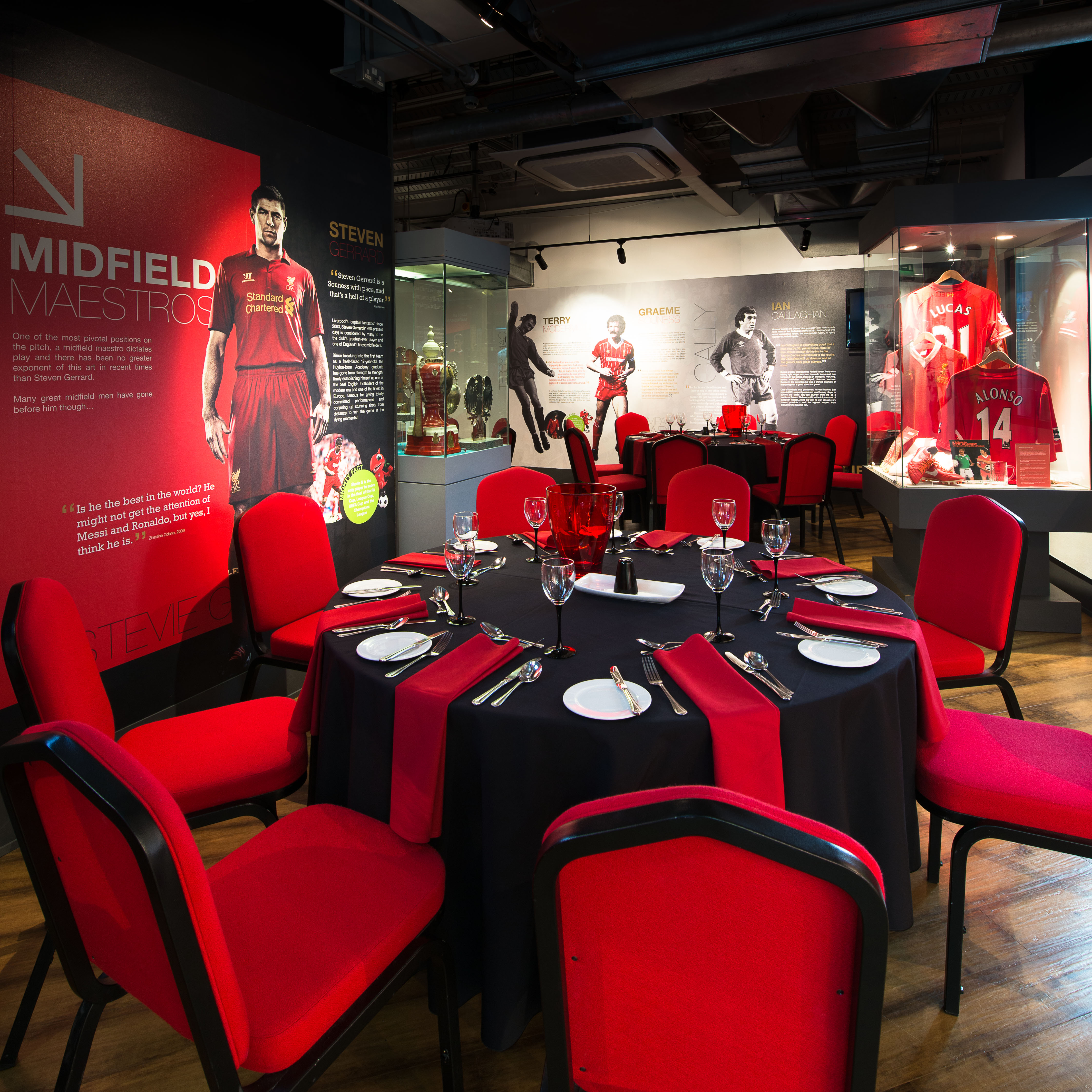 Liverpool FC Story event space with round dining setup, perfect for corporate events and fan gatherings.