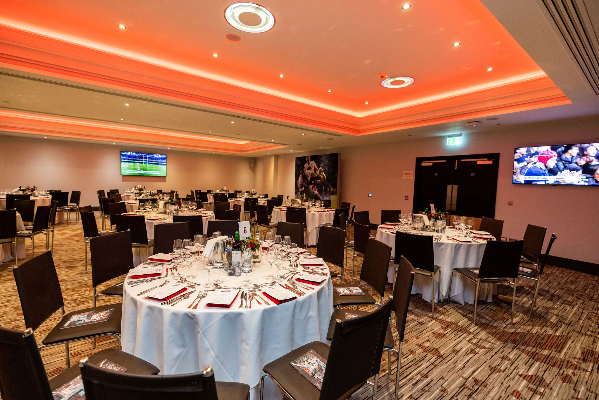 Elgar Suite at Allianz Stadium: elegant event space with round tables for corporate gatherings.