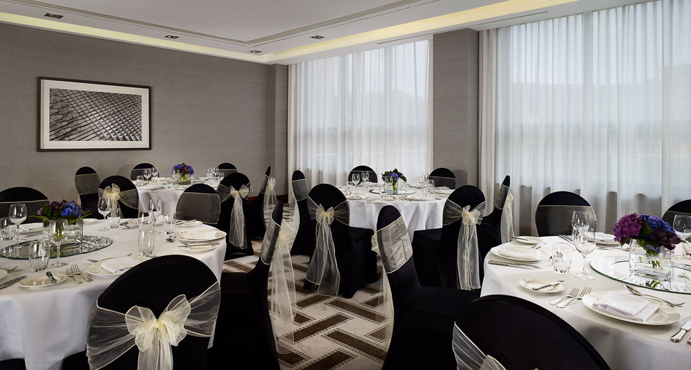 Elegant event space at Hyatt Regency Birmingham with round tables for weddings and corporate events.