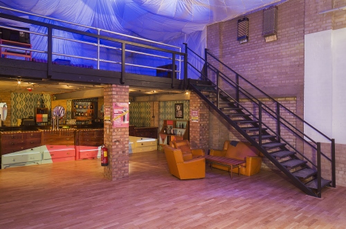 Main room at The Night Owl: spacious event space with stylish bar, ideal for networking events.