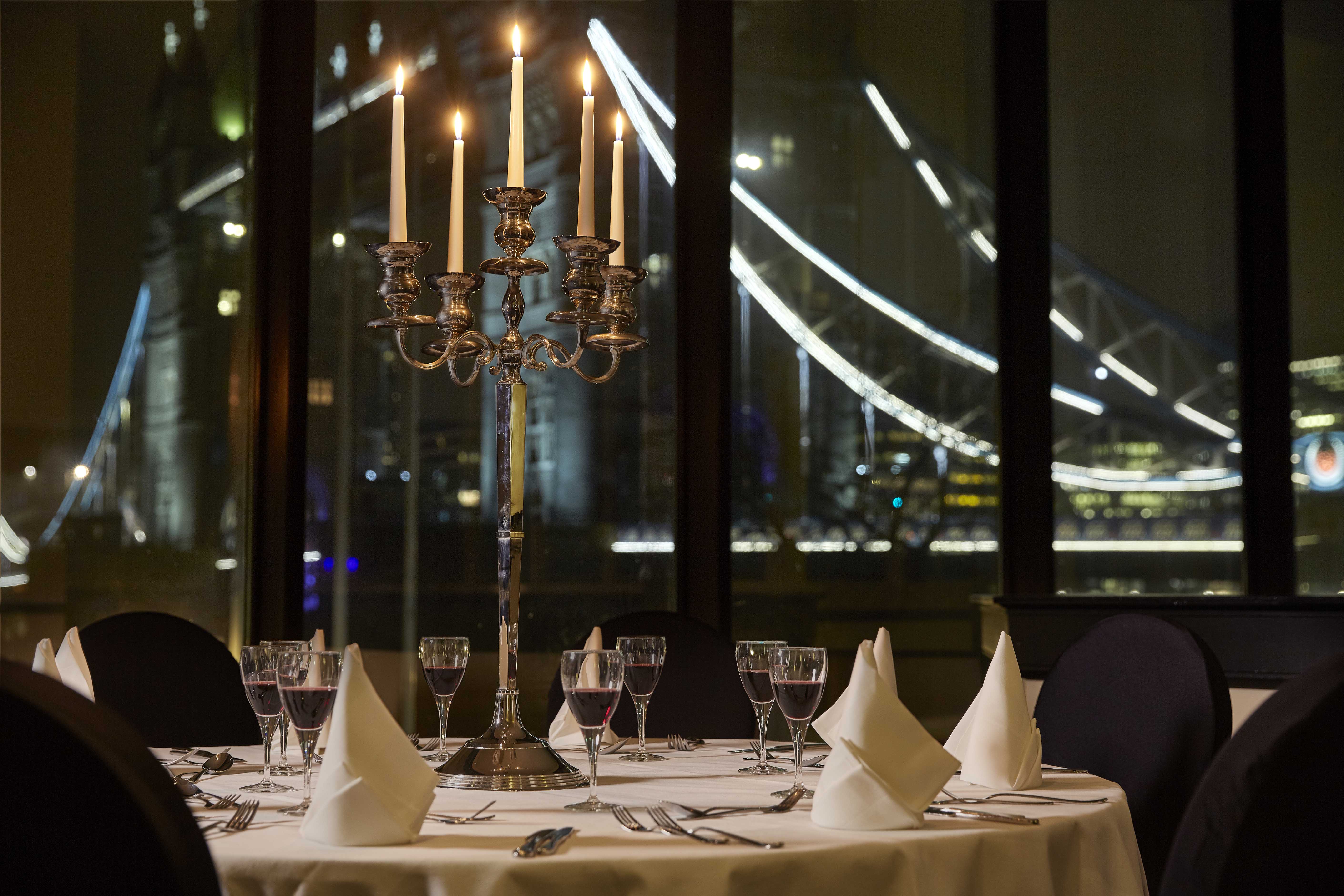 Elegant Tower Suite dining table with candelabra, perfect for upscale events.