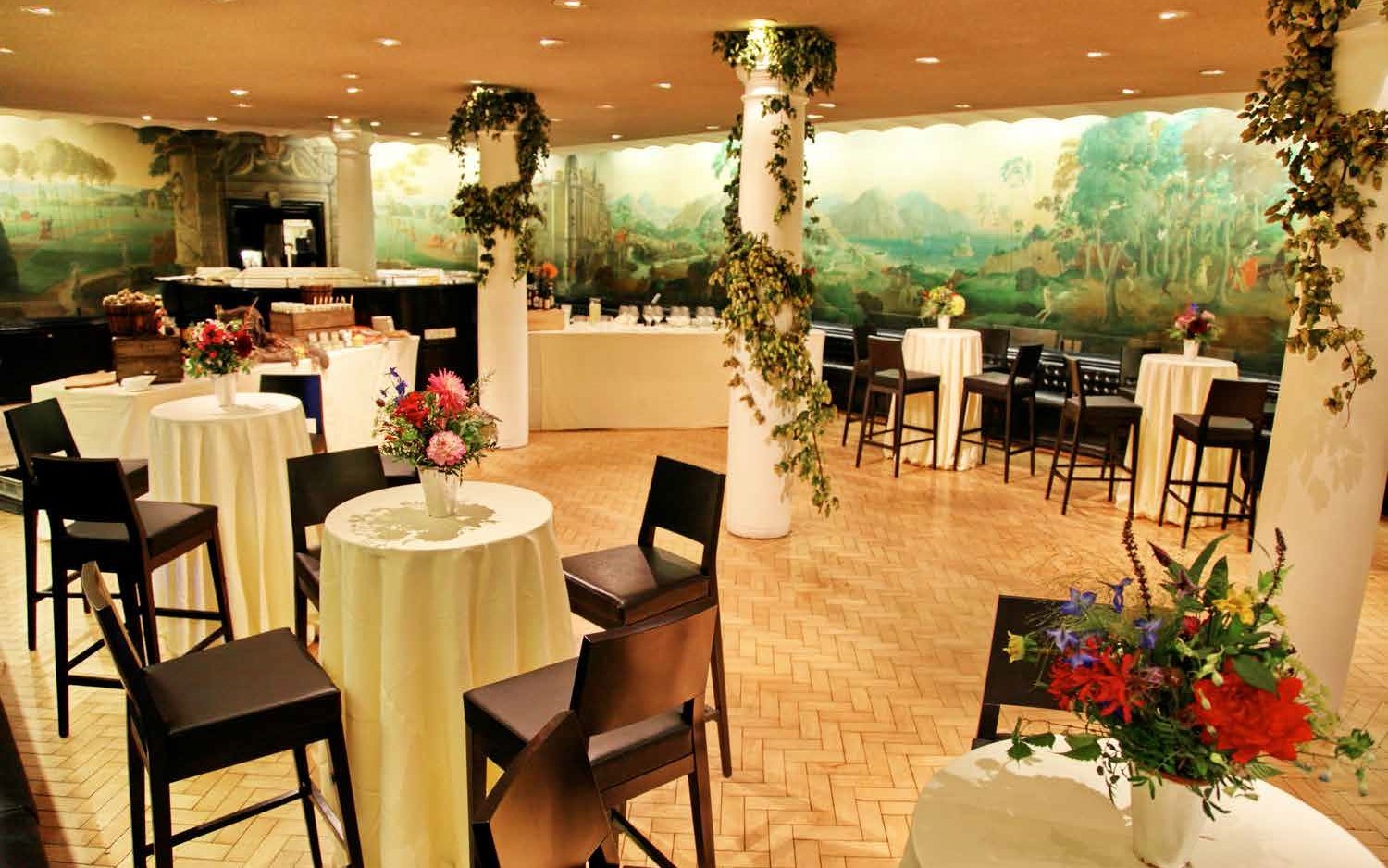 Elegant Rex Whistler Restaurant event space with floral centerpieces, perfect for receptions.