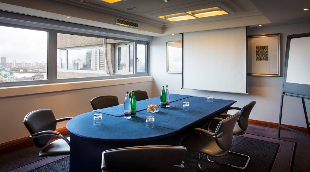 Resolution Suite meeting room with oval table, ideal for corporate events and presentations.