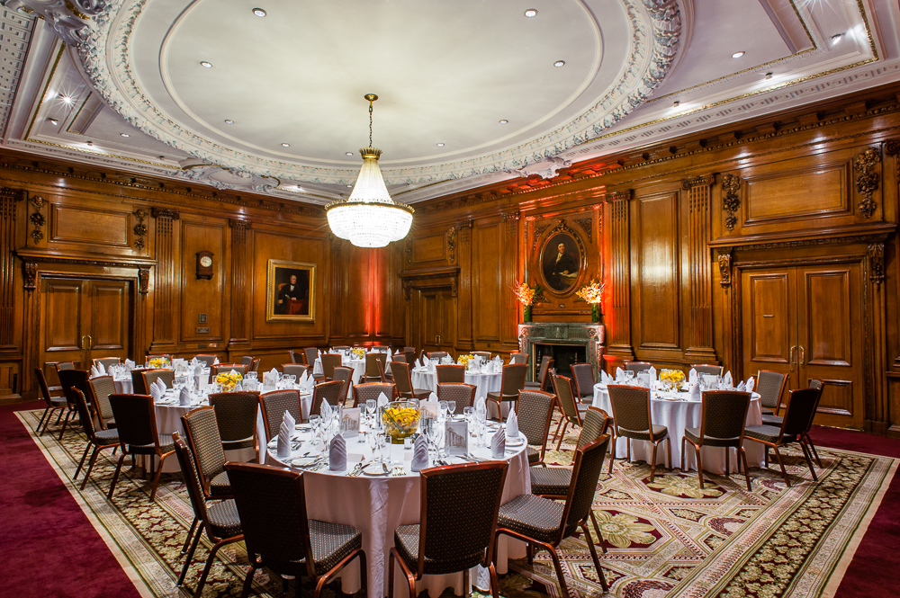 Elegant Council Room with round tables, ideal for formal dinners and corporate events.