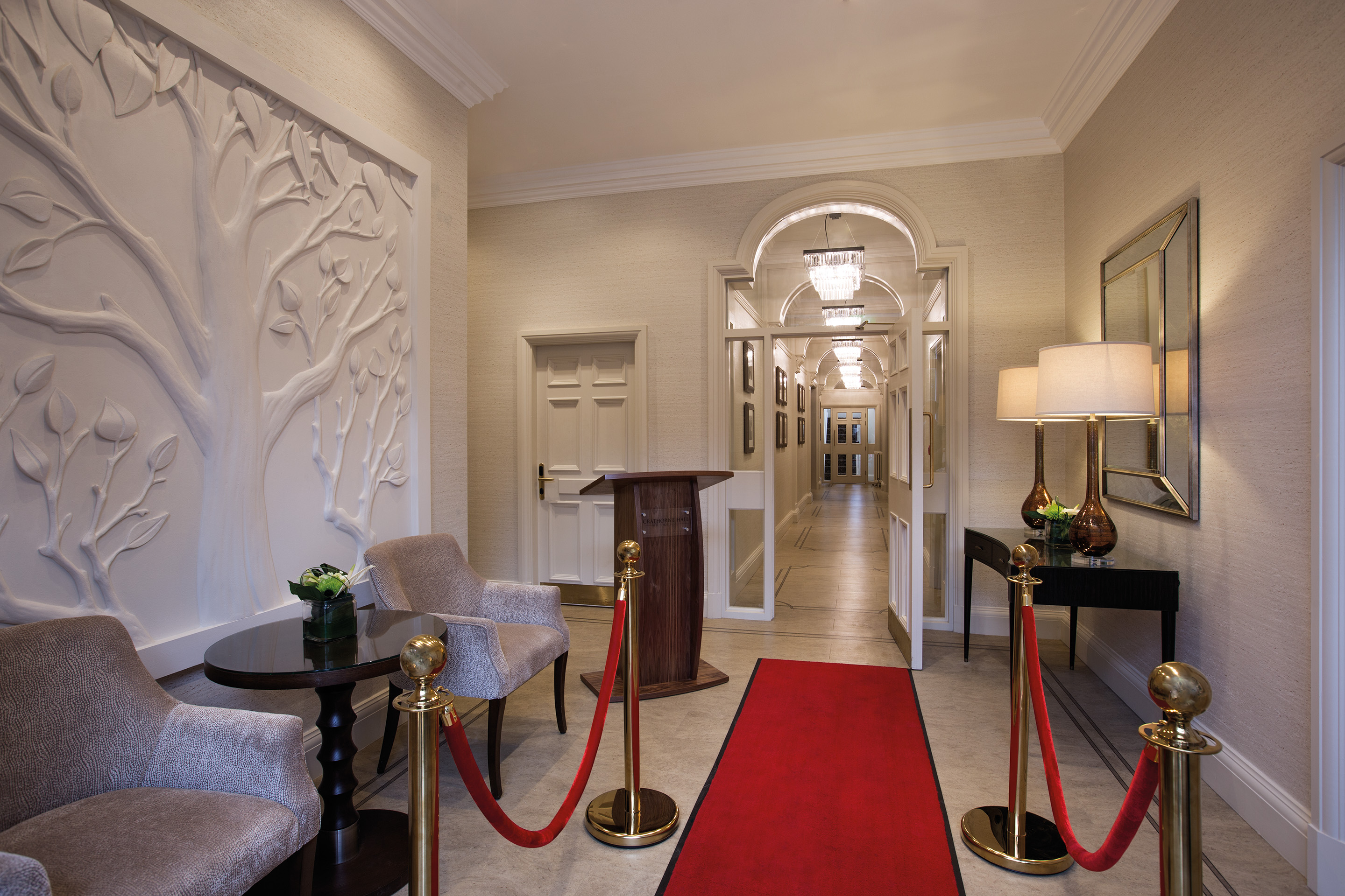 Elegant Crathorne Hall entrance with plush red carpet, ideal for receptions and events.