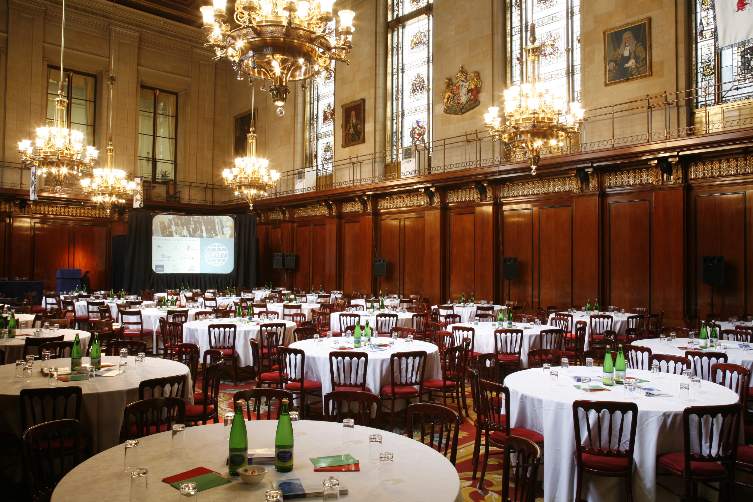 Great Hall at Merchant Taylors' Hall, elegant tables set for formal conferences and banquets.