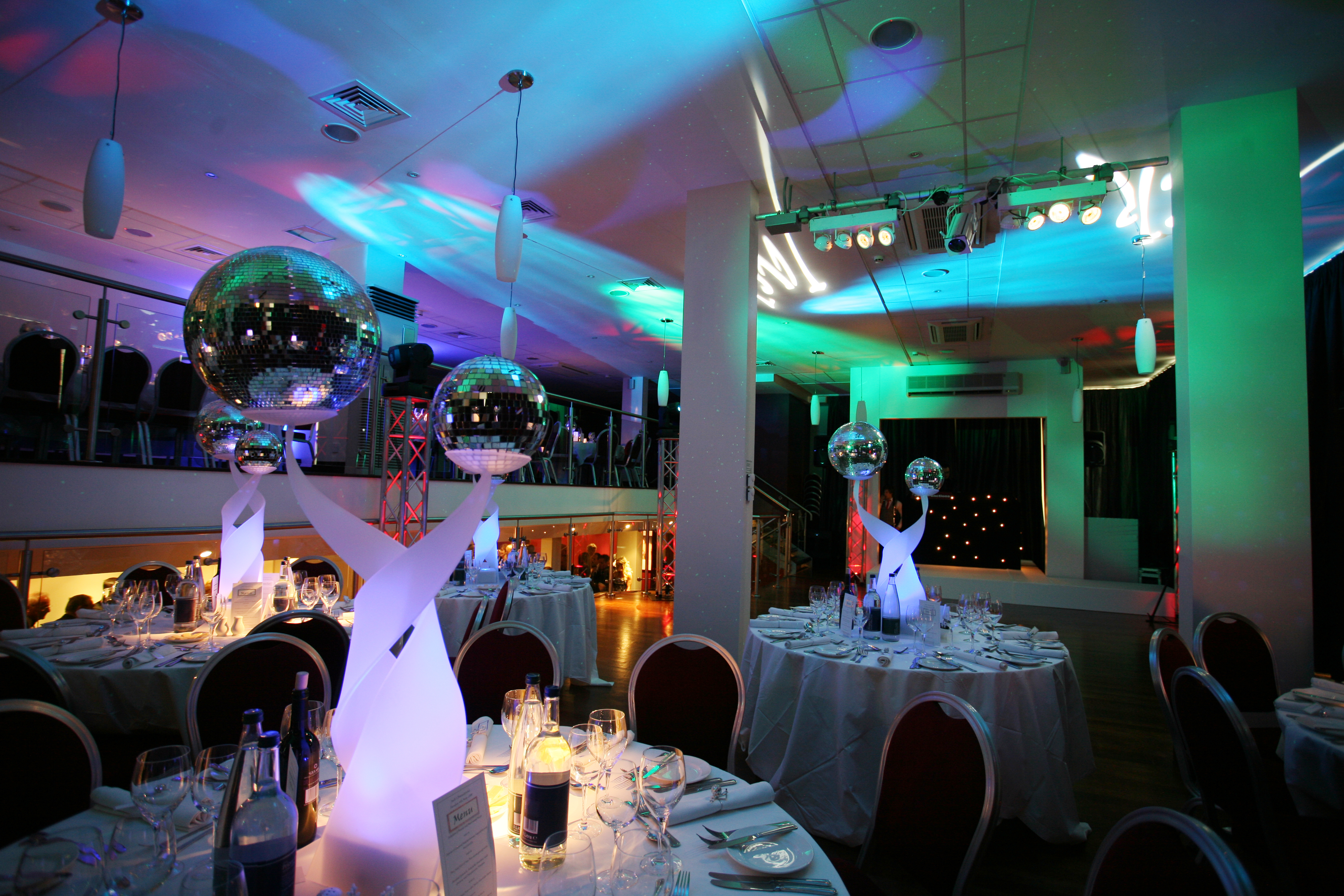 Elegant event space at Holiday Inn Camden Lock, set for formal dinner with vibrant lighting.