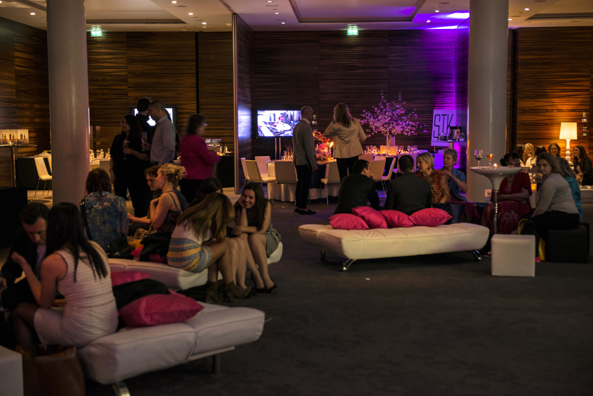 Vibrant ME London event space with stylish seating for networking and social events.
