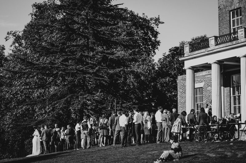 Outdoor wedding at Clissold House with lush greenery and elegant architecture.
