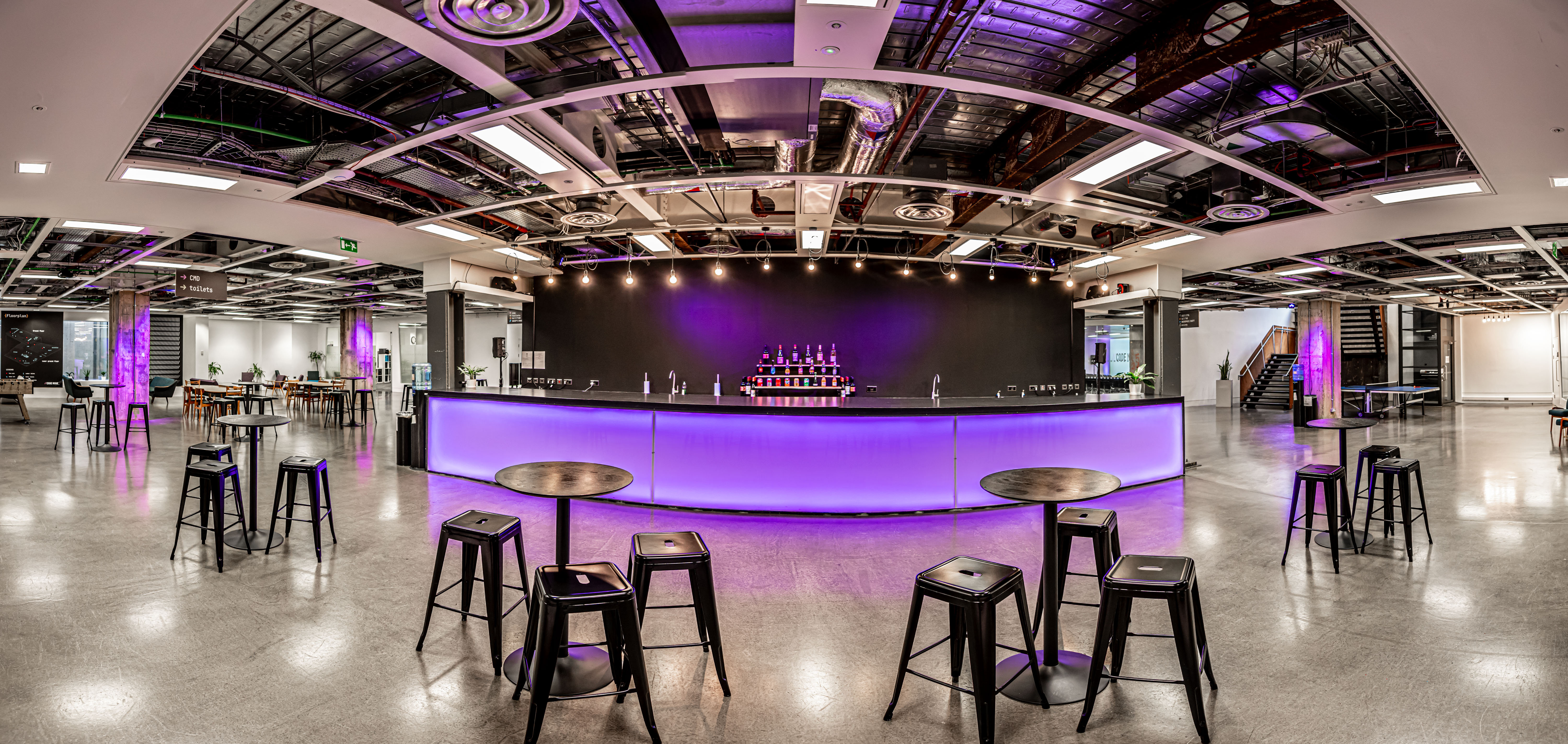 Modern event space, illuminated bar, cocktail reception, product launch