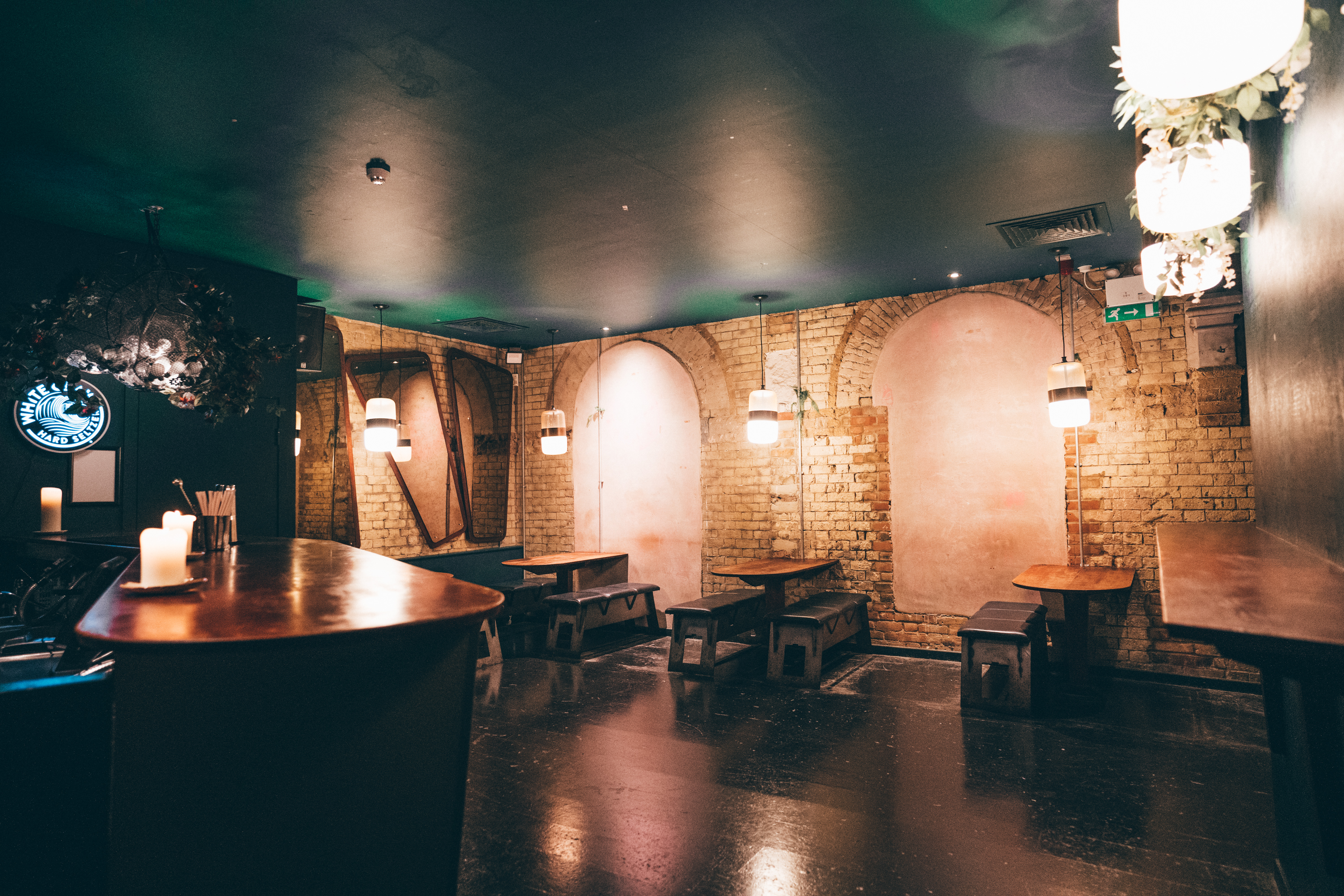 Rustic event space in Oslo Hackney with exposed brick, ideal for gatherings and networking.