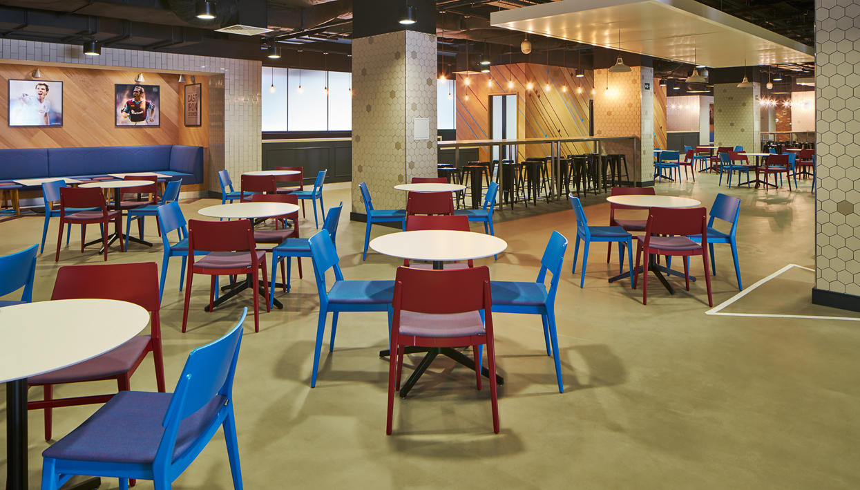 The Boleyn event space in London Stadium with modern furniture for networking and gatherings.