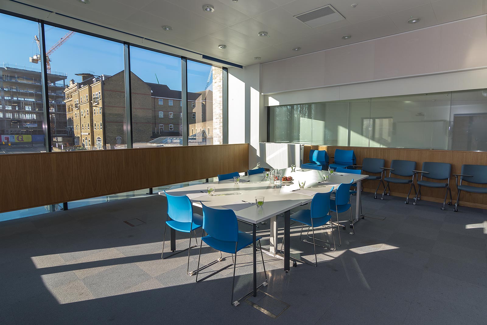 Modern Camberwell Meeting Room 3 with large white table, ideal for workshops and events.