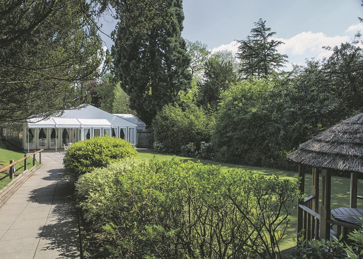 Serene outdoor venue at New Hall Hotel, ideal for corporate retreats and social gatherings.