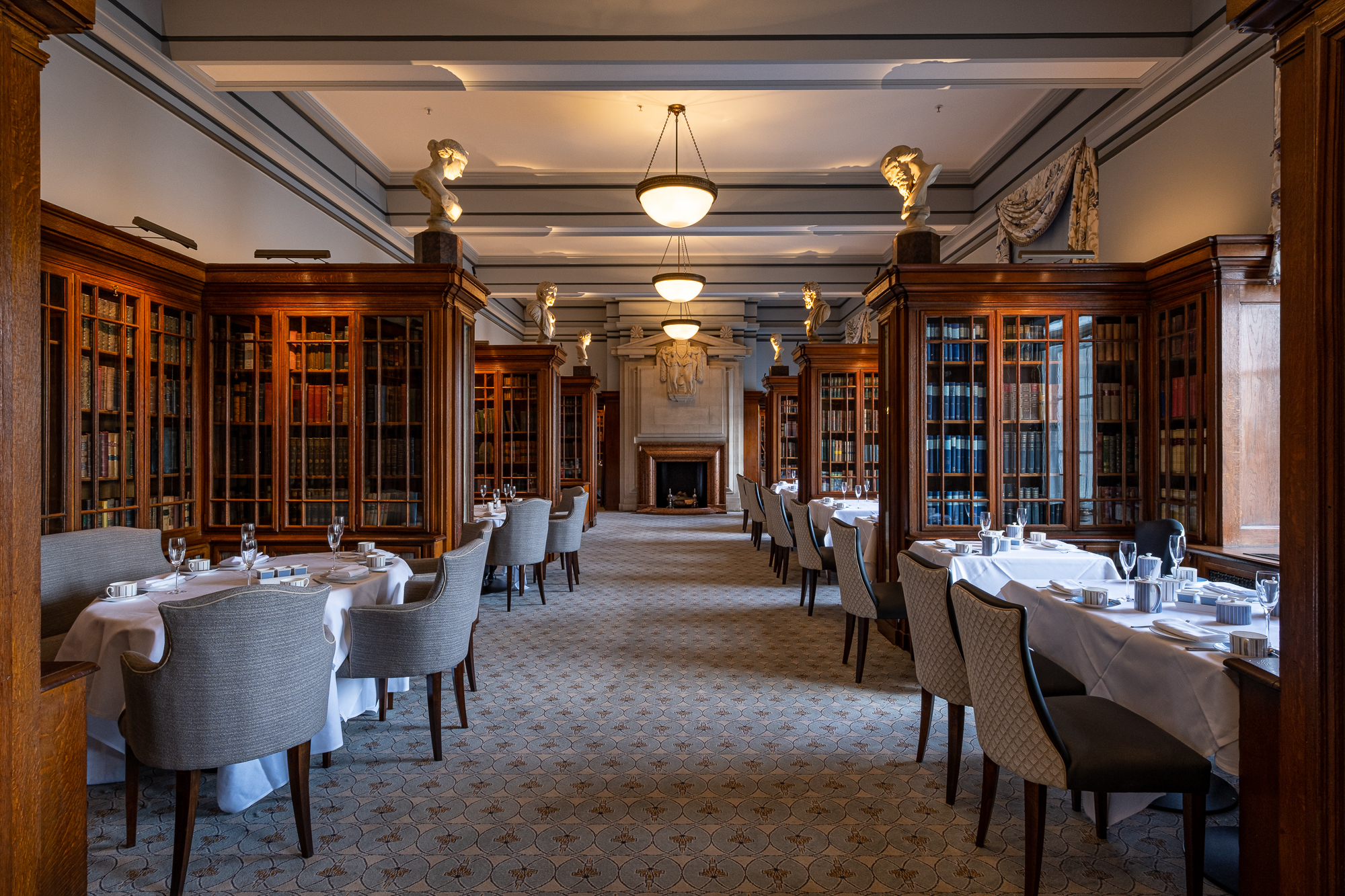 Private dining room at London Marriott Hotel County Hall with classic library aesthetic.