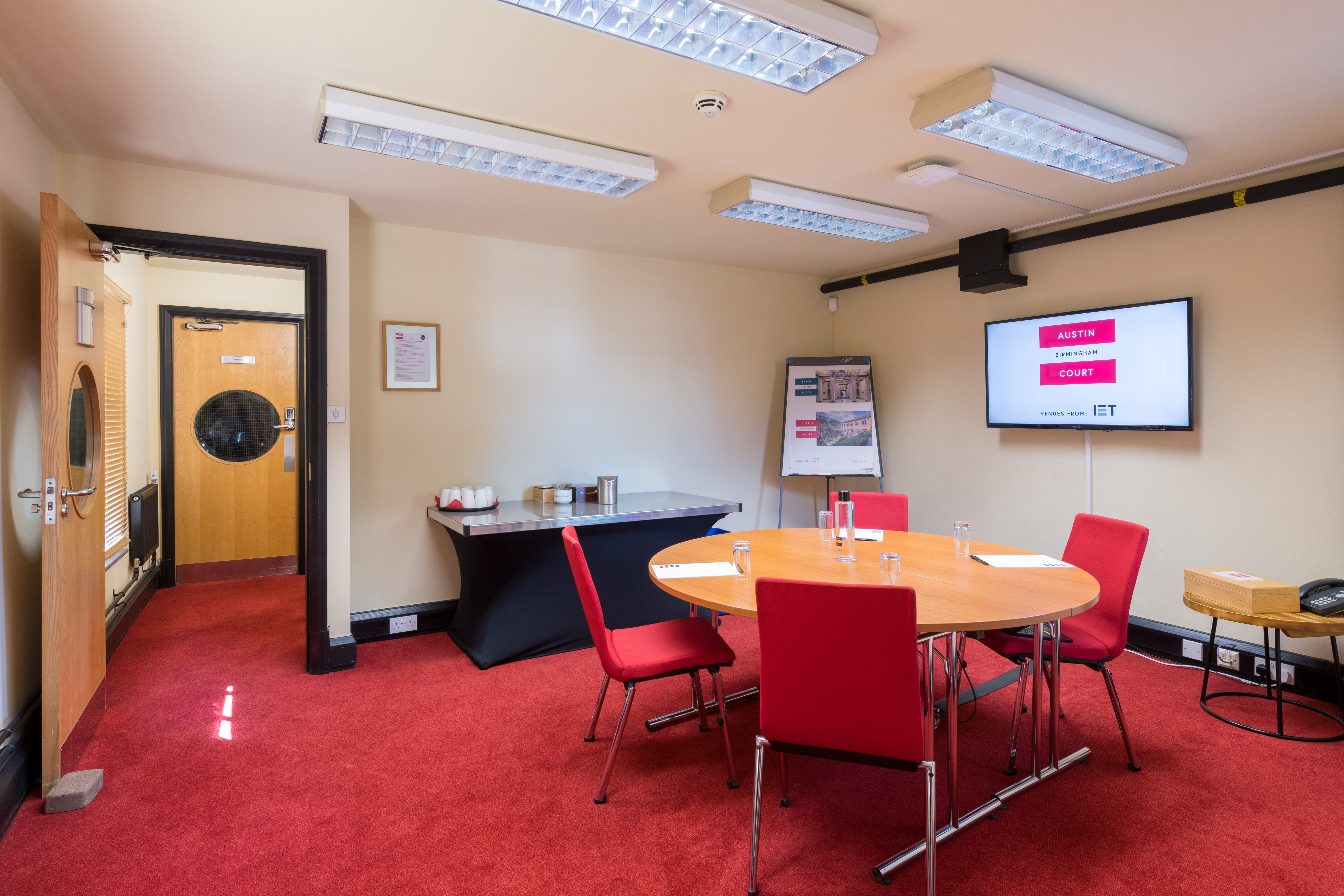 Brindley Room at IET Birmingham: Austin Court, featuring a round table for meetings.