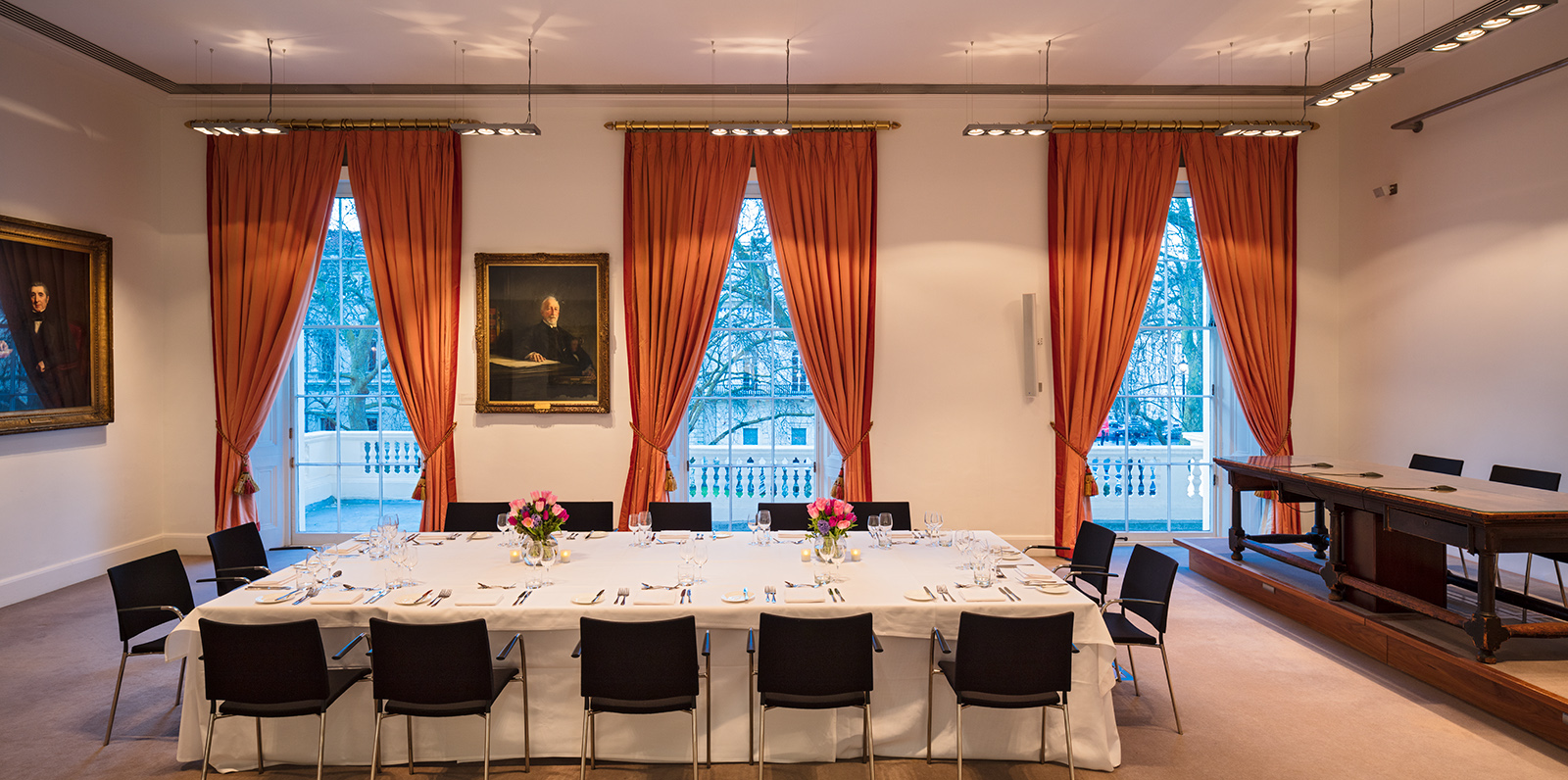 Elegant conference room with round table, ideal for corporate events and gatherings.