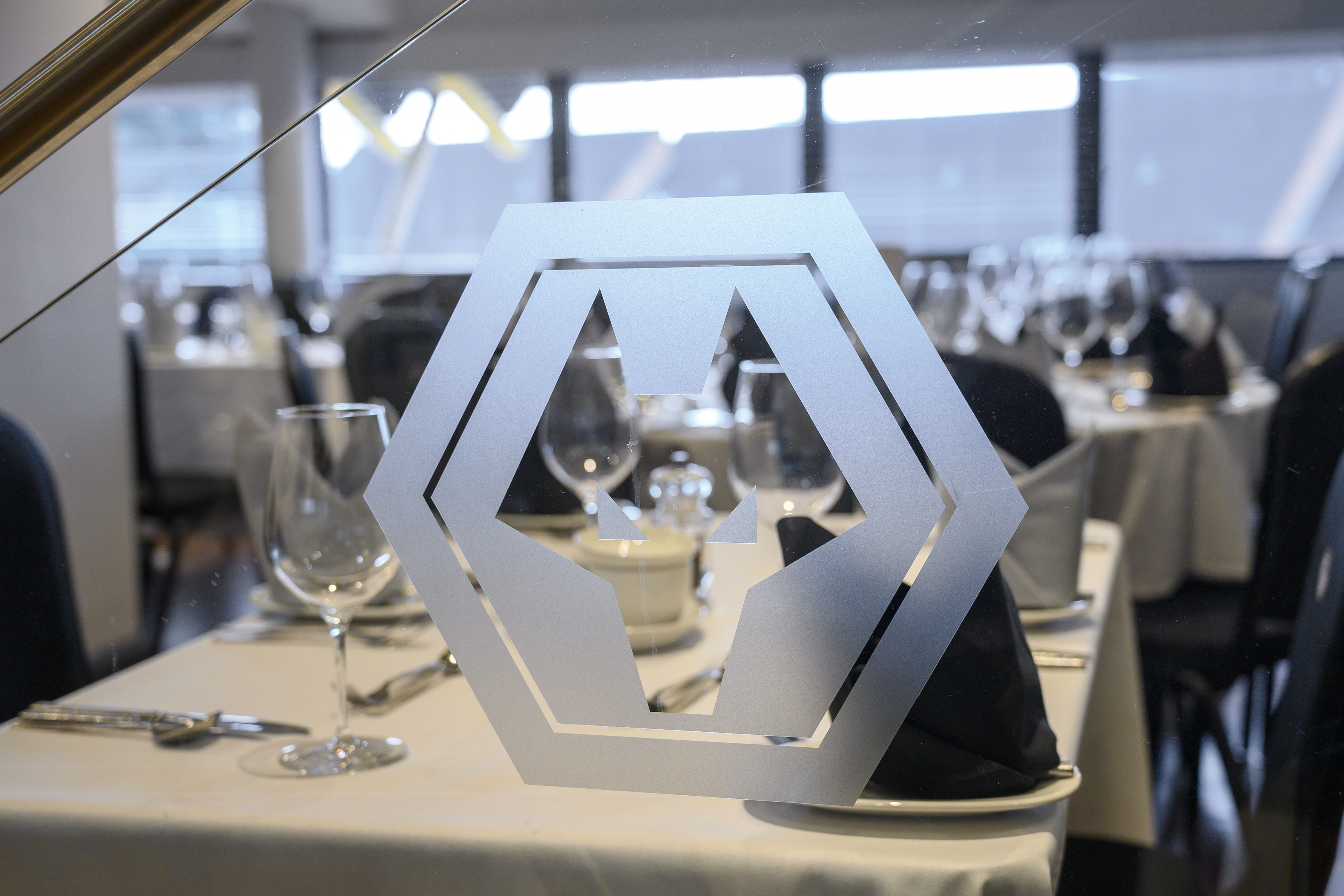 Boardroom at Molineux Stadium with elegant table settings for corporate events.