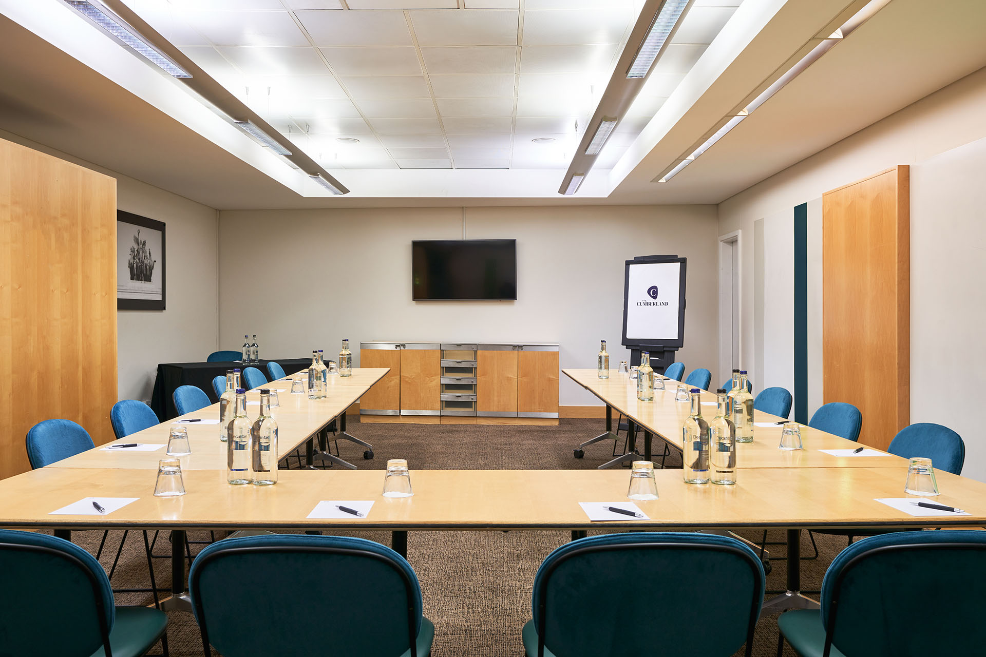 Meeting room at The Cumberland Hotel with U-shaped tables for professional gatherings.