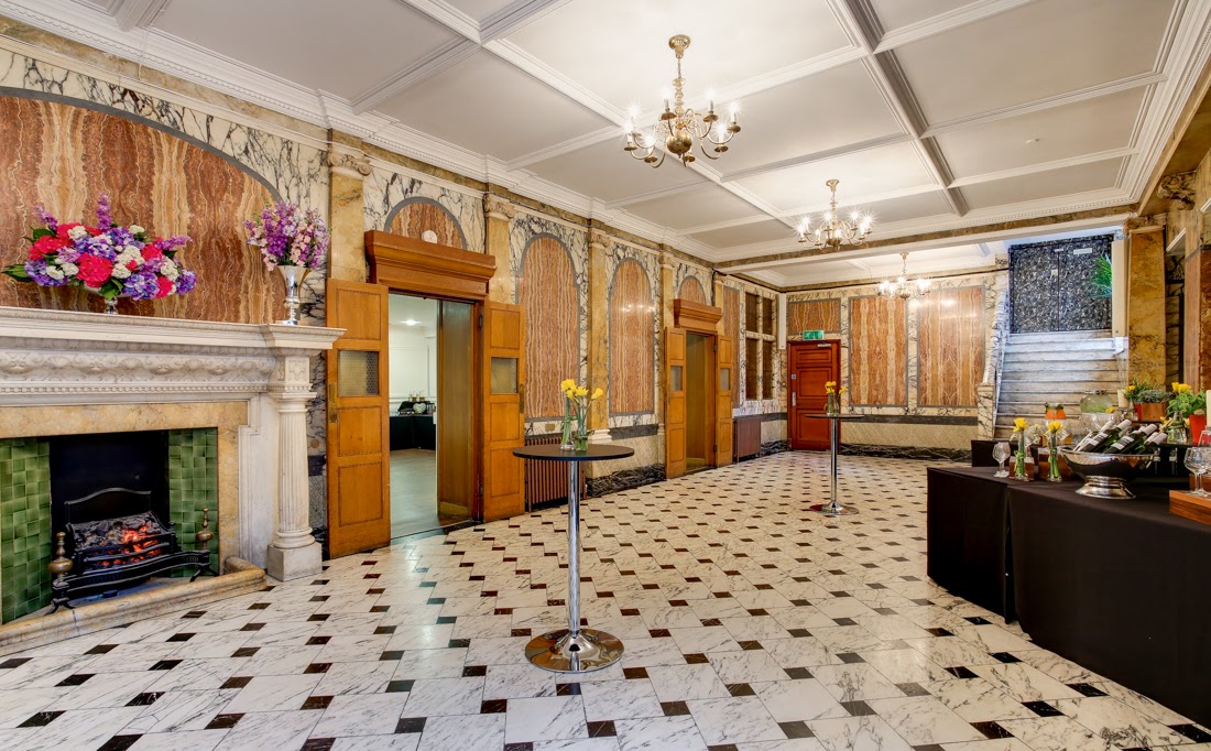 Elegant Marble Hall event space with marble flooring, ideal for receptions and networking.