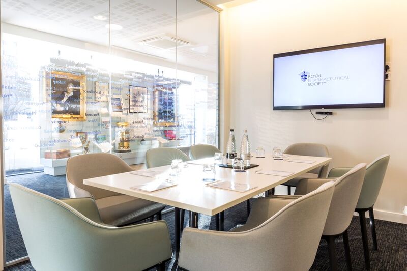 Modern meeting room at The Royal Pharmaceutical Society with glass walls for collaboration.