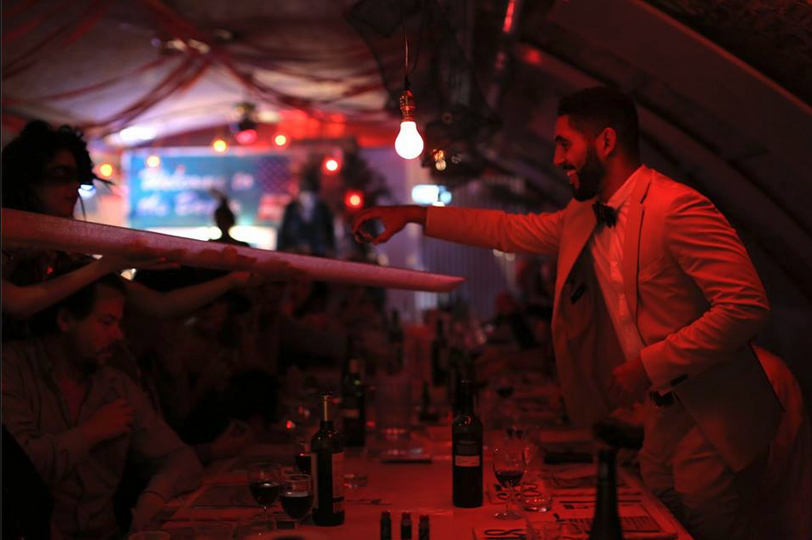 Intimate dining event at The Vaults with warm lighting and elegant decor.