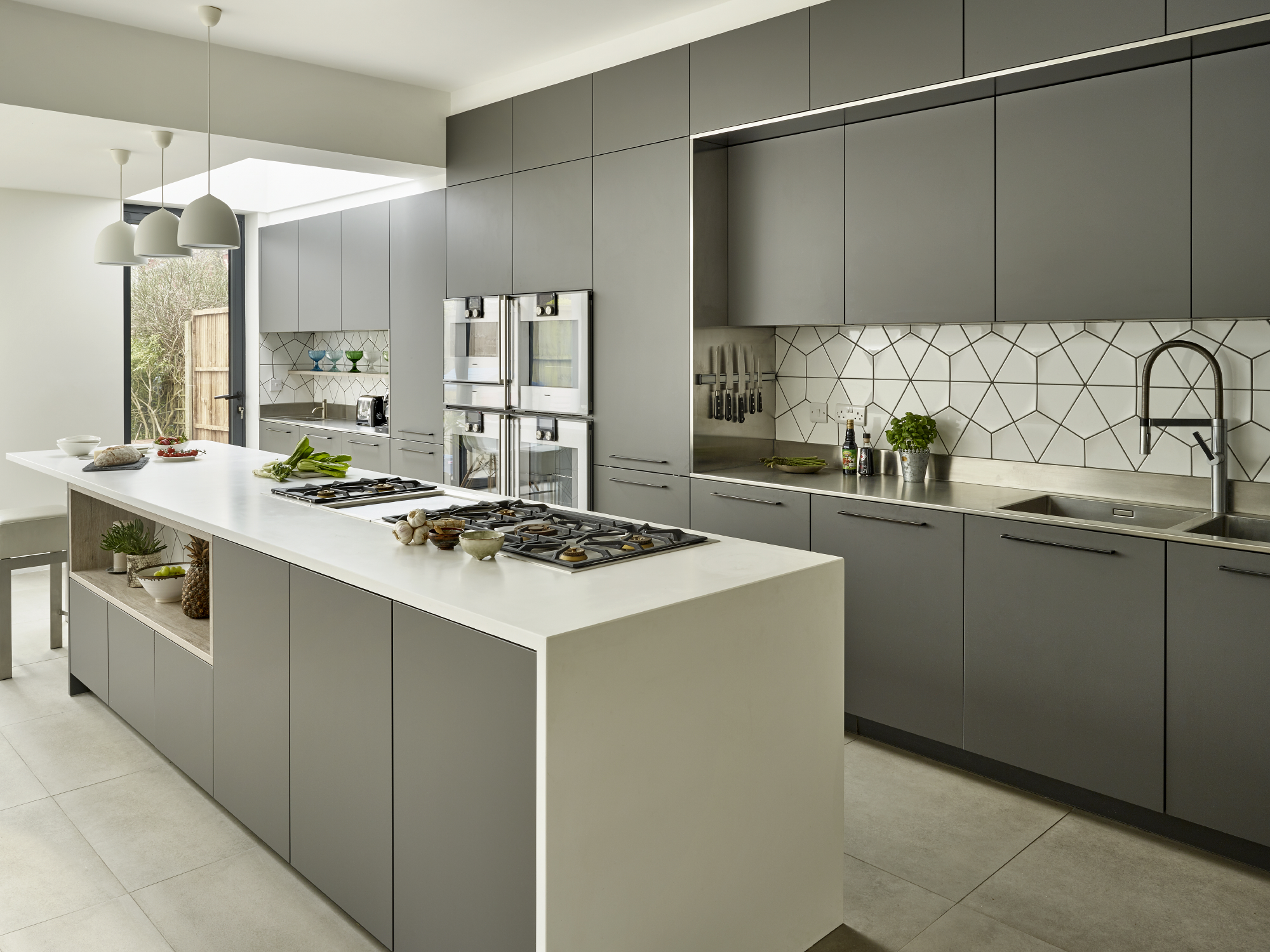 Modern kitchen with central island for cooking classes and culinary events.