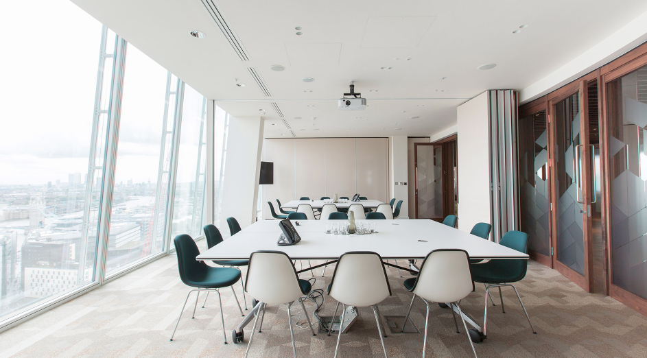 Modern meeting room in The Shard with large windows for corporate gatherings. - Banner