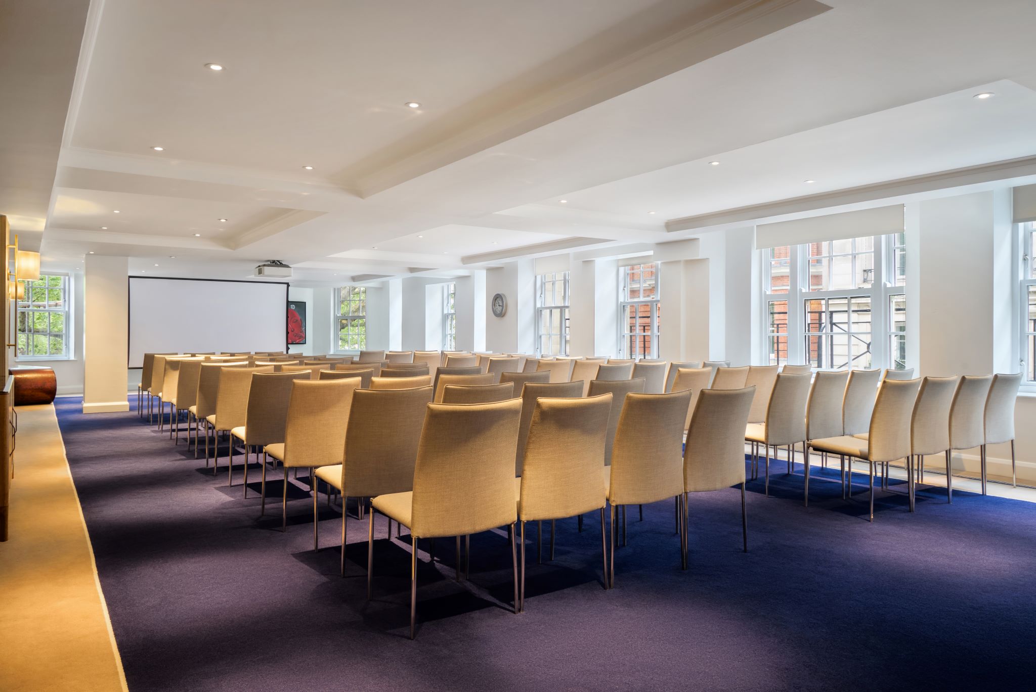Theater-style meeting room in The May Fair Hotel, ideal for professional presentations and events.