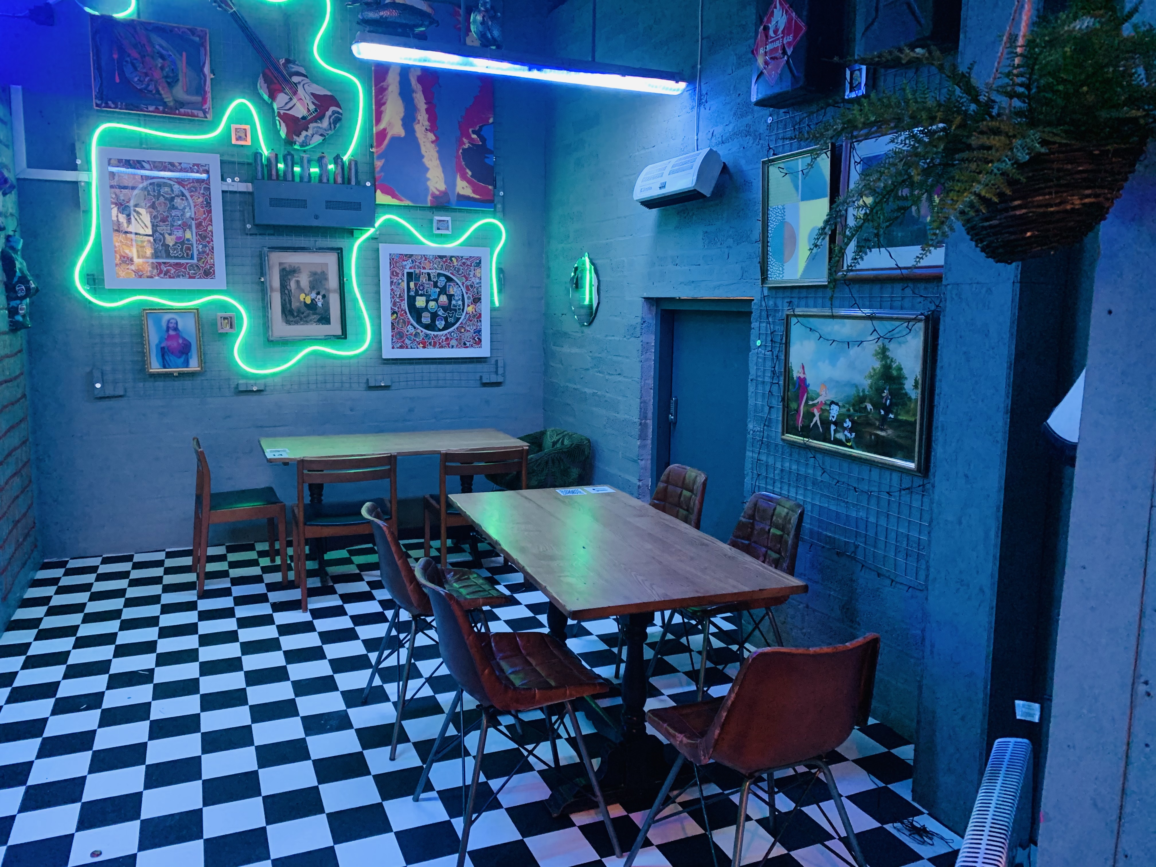 Vibrant meeting space with neon lighting, ideal for workshops and team-building events.