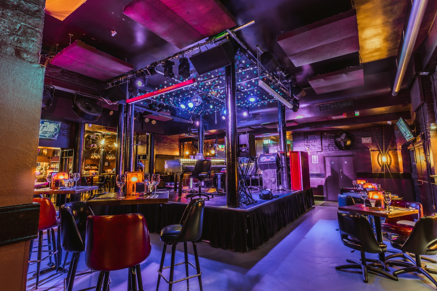 Vibrant event space at The Piano Works Farringdon with dynamic stage lighting.