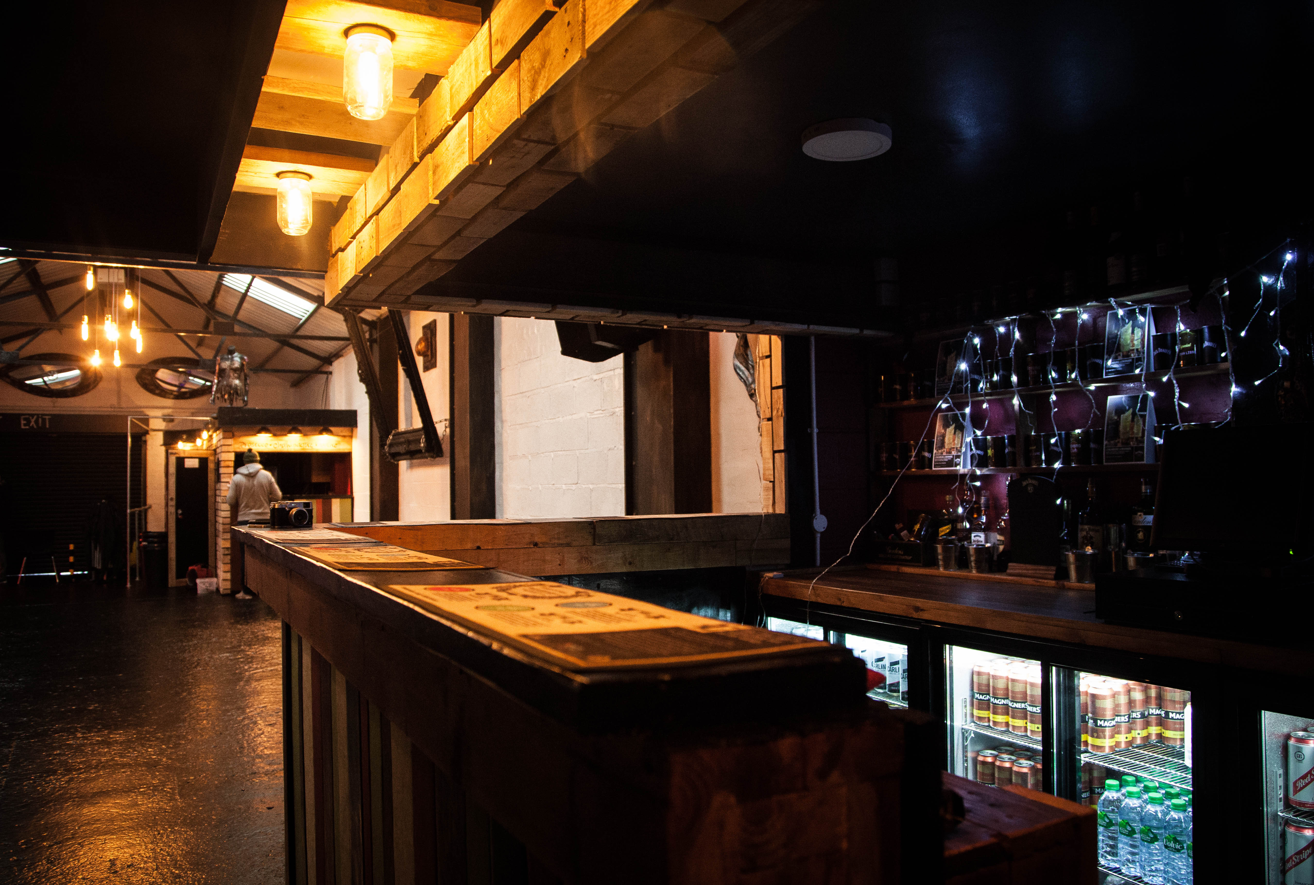 Stylish Engine Room venue with rustic bar, perfect for events and gatherings.