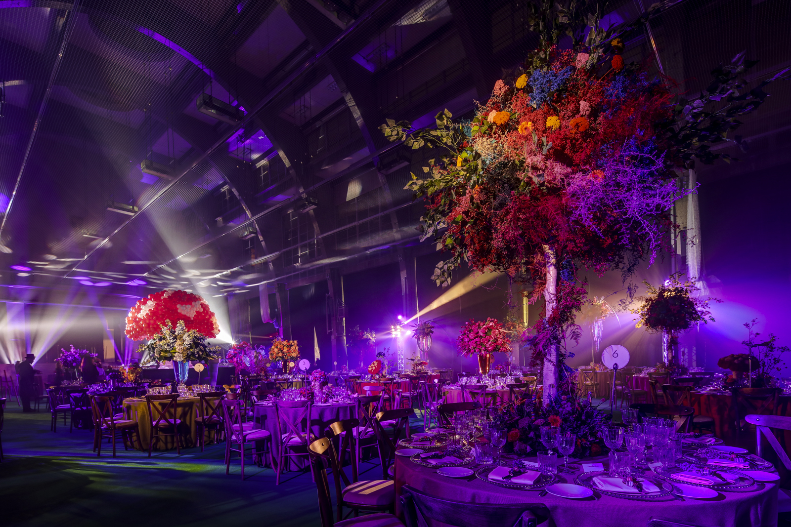 Lawrence Hall with floral arrangements for a high-end gala event. - Banner